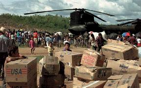 Organization and Command Relationships for Civil-Military Operations US Army CH-47 helicopter delivers supplies to villagers of Casamacoa, Honduras during Hurricane MITCH relief operations.