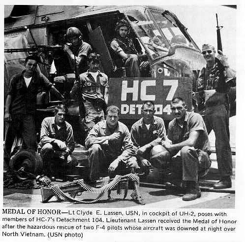 Clyde E. Lassen, in the cockpit of his UH-2 helicopter, and his crew after his rescue of the two F-4 pilots.