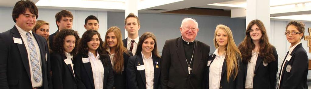 Saint Mary s High School students enjoy the company of the Most Reverend William F.