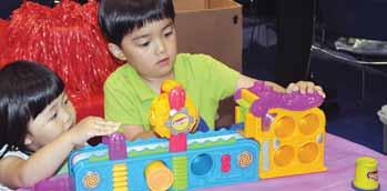 Huiseong and Hyeonseong Kang find the absence of Play Doh no deterrent to their interest in the Early Autism Project