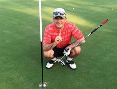 John Borman celebrates a hole in one he shot on Fort Jackson s Wildcat course during an intramural round Aug. 4.