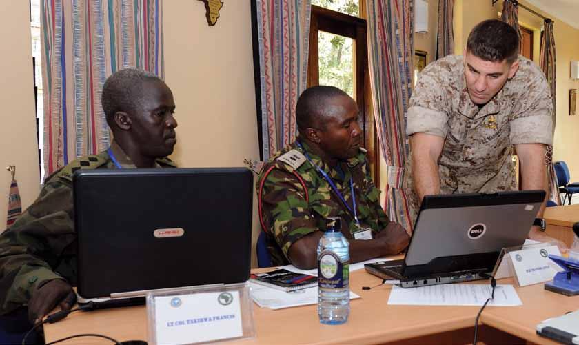 U.S. Air Force (Christine Clark) Forum Building Partner Capacity in Africa Marine operations officer mentors students from Uganda and Kenya at International Peace Support Training Centre, Nairobi