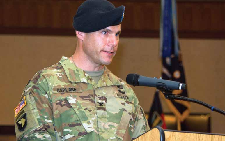 Photos by ROBERT TIMMONS Col. Patrick C. Aspland speaks June 30 at the Fort Jackson Officer s Club during a change of command ceremony. Aspland took command of the 165th Infantry Brigade from Col.