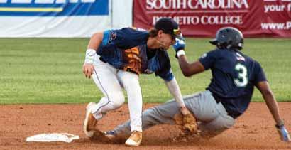 Below, Lexington Blowfish second baseman Chase Turner tags out the Savannah Bananas Christian Hollie during the top of the third inning.