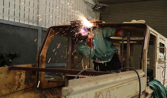 A Red River Army Depot team member conducts welding work inside the hull a Mine Resistant Ambush Protected Vehicle. The depot is capable to rebuild and repair each variant of the MRAP.
