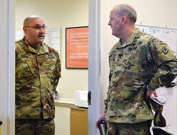 Training days VILLAGE AT SANDHILL Recruiting Assistance Center leader, Staff Sgt. Ian Gamkoe, left, explains steps recruiters take to avoid erroneous enlistments to Fort Jackson commander Maj.