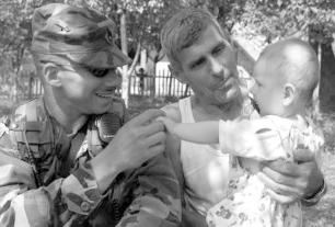 LOT HOUSES US Army An American infantryman in Bosnia plays with an infant, August 2002. anticipated future developments in BiH.