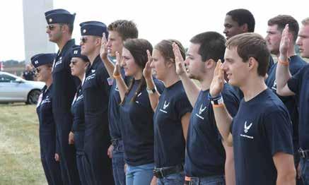 CENTER: Members of the 339th RCS A-Flight Delayed Entry Program take the Oath of Enlistment as U.S. Air Force Thunderbird team members stand beside them at the air show July 2.