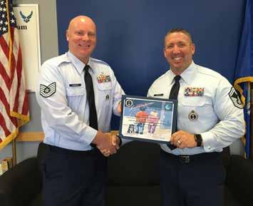 Congratulations Senior Master Sgt. David Jackson, 338th Recruiting Squadron production superintendent, congratulates Tech. Sgt. Jason Harrick, C-Flight, on achieving his recruiter certification in Cincinnati, June 30.