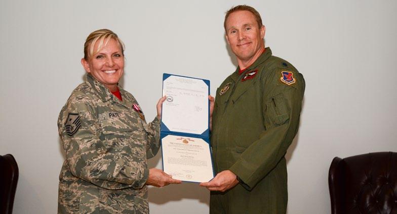 12 December 2014 UTA IN REVIEW Highlights from the November UTA Master Sgt. Paula Pate poses with Lt. Col.