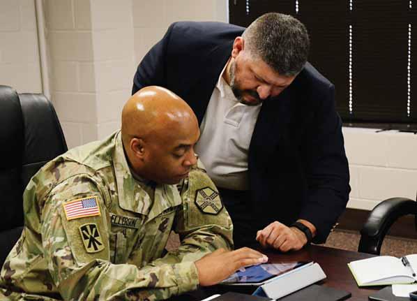 Virtual town hall meeting NEWS Nicholas Salcido, Fort Jackson s social media manager, helps Garrison Commander Col. James Ellerson Jr.