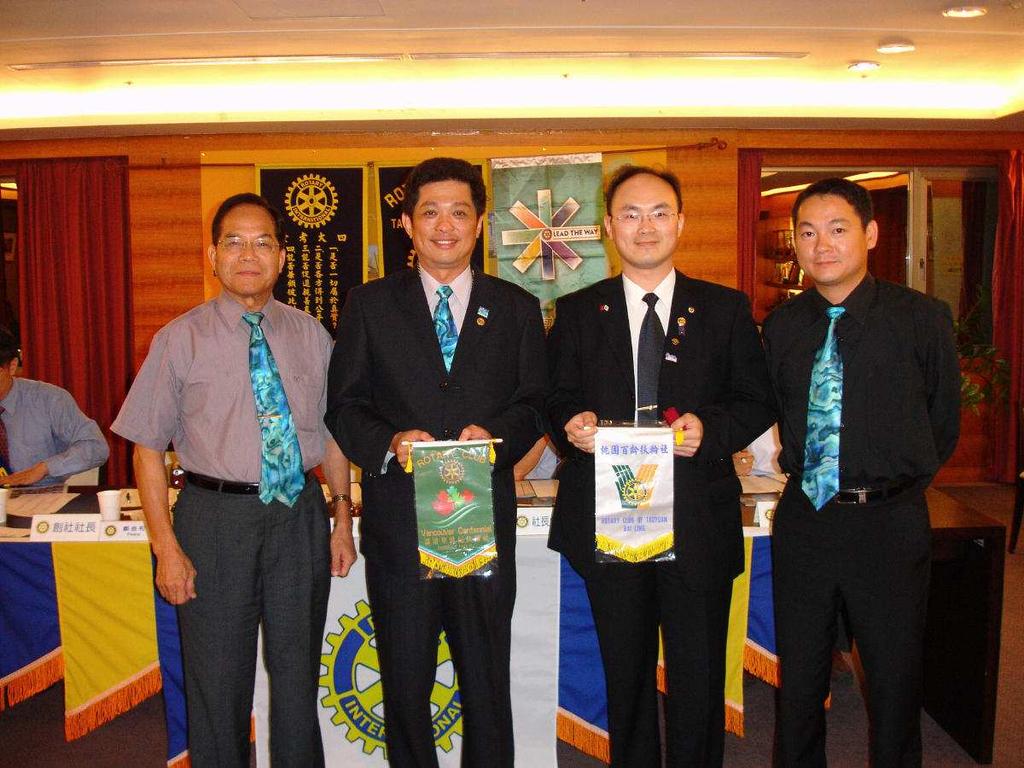 Page 4 of 5 CP Peace;President Grinder;Quentin and Rtn. President Grinder and Quentin Sport Rtn. Quentin had attended four Rotary clubs' meetings during the two-weeks stay at Taiwan.