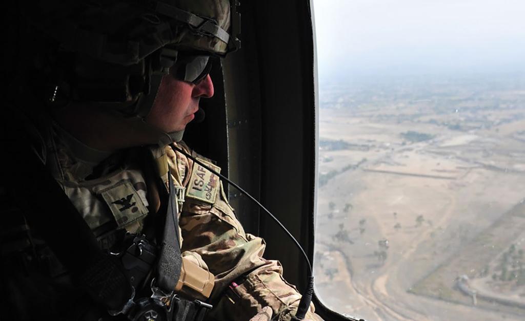 (Photo courtesy of Col. Val Keaveny) Col. Val Keaveny flies over his brigade s former area of operations 31 October 2013 in Khost Province, Afghanistan.