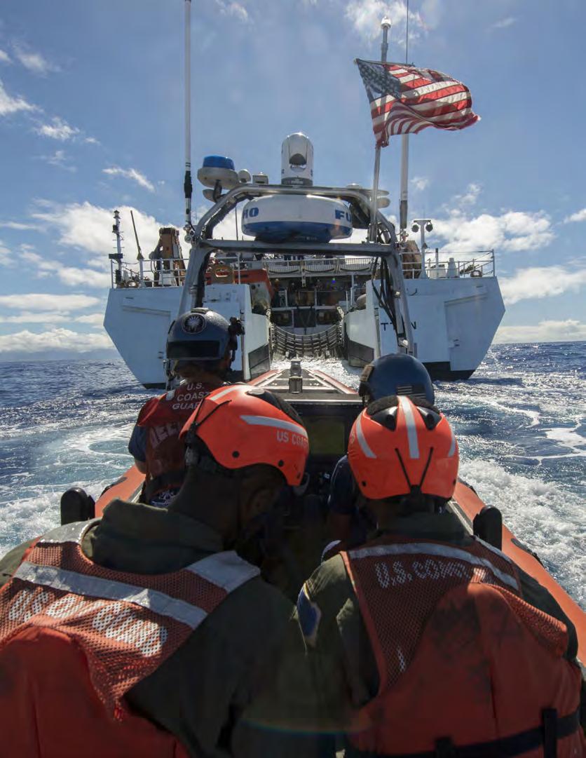 Coast Guard Cutter STRATTON crewmembers aboard Coast Guard small boat return to the ship after a