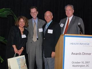 Greg Larkin and Randy Howard accept the award on behalf of the Indiana Health Information Exchange