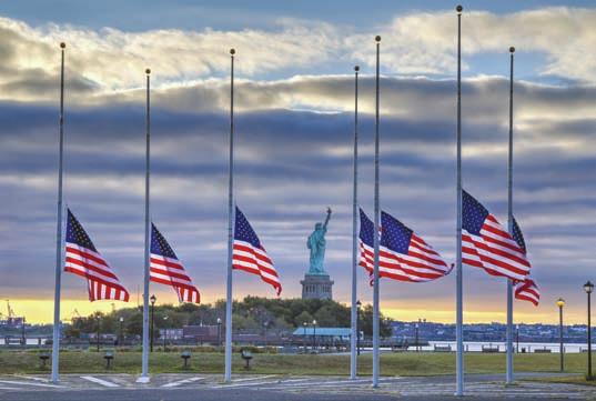 To place the flag at half staff, you should hoist it to the peak for an instant and lower it to a position half way between the top and bottom of the staff.