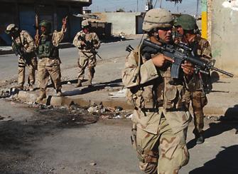 SSG Len Danhouse, 3rd ACR, conducts a combat patrol in Tal Afar in February 2006. Attacks in the city were reduced from 170 to fewer than 20 per month by the time the Brave Rifles redeployed.