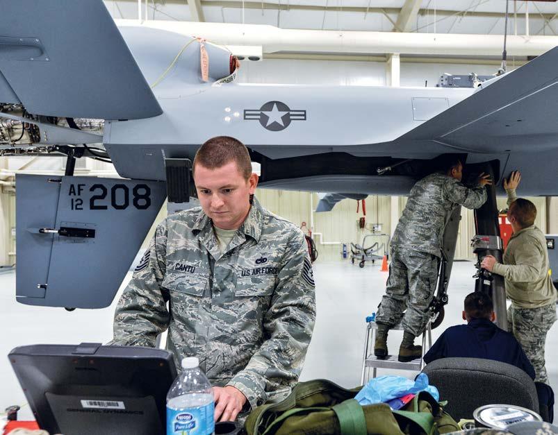 USAF photo by SrA. Adarius Petty An instructor and students perform remotely piloted aircraft maintenance training at Det. 13 of the 372nd Training Squadron. The Creech AFB, Nev.