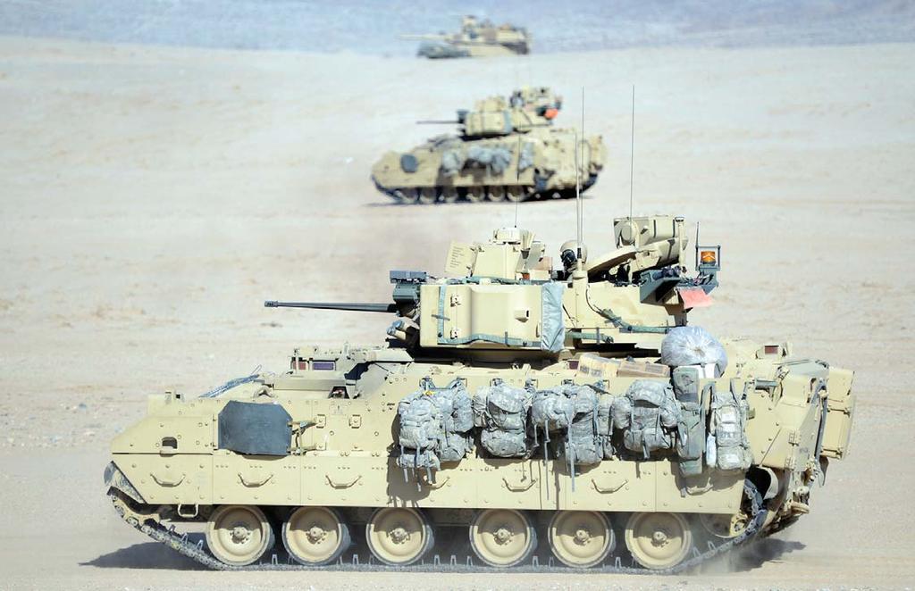 Photo by EJ Hersom Vehicles from the 2nd Armored Brigade Combat Team, 1st Infantry Division maneuver through the desert at Fort Irwin, Calif., on 24 February 2013.