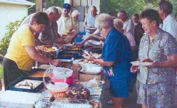 Chapter 126 members have plenty to eat and lots to laugh about at their August picnic in Ohioview, PA.