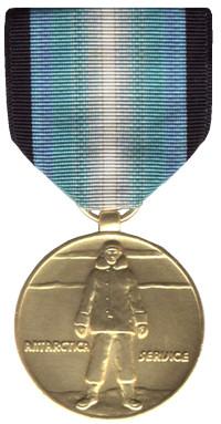National Defense Service Medal: On a bronze medal, 1 1/4 inches in diameter, an eagle displayed with inverted wings standing on a sword and palm branch, all beneath the inscription NATIONAL DEFENSE.