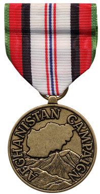 Kosovo Campaign Medal: A bronze medal, 1 1/4 inches in diameter, with the stylized wreath of grain, reflecting the agricultural domination of the area and its economy, symbolizes the basic human