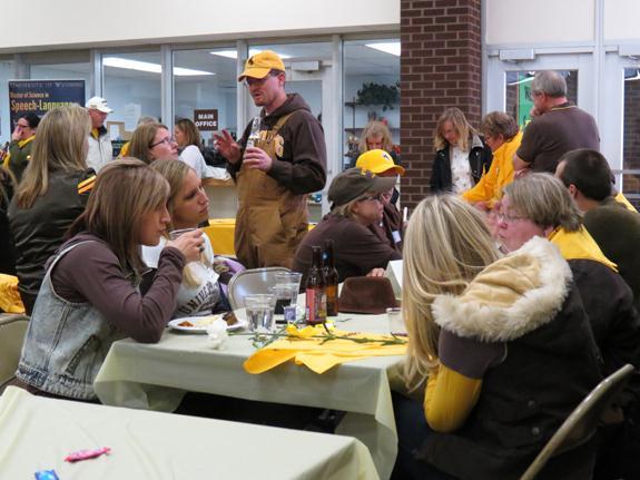 Friends and Alumni of the College of Health Sciences enjoy time together before the football game.