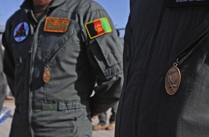 SECURITY AAF pilots wear Black Hawk pendants marking their completion of UH-60 helicopter training at Kandahar Airfield, Afghanistan. (USAF photo by Sgt.