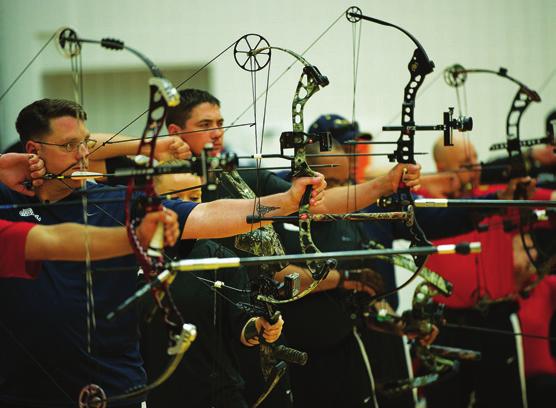 Above, archers on the shooting line during