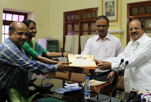 2 Gudibande Tahsildhar S. Shailaja and Shirestedars Sigatullah receiving a certificate from Minister for Law and Parliamentary Affairs and Animal Husbandry T.B.