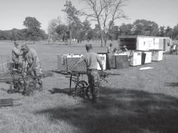 Soldiers prepare decontamination equipment. Combining soap with bleach and water offers the most thorough removal of contaminants; however, it normally results in time delays due to supply issues.