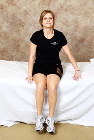 Scoot your buttocks back so that your knees are back against the bed.