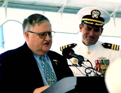 (L) Jack Mayo is shown accepting a plaque from USS Austin s Captain, Commander Kevin Flanagan, thanking the Greater Central Texas Council of the Navy League for supporting the ship throughout its