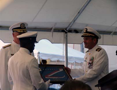 The Commissioning Pennant flown during USS Austin s final deployment was presented to the Command Master Chief. Austin returned from the Persian Gulf to her homeport of Norfolk this past year.