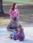 ON THE COVER A drill sergeant helps his daughter adjust her backpack to be more comfortable as he and his Family await Pierce Terrace Elementary School s doors to day of school.