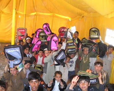 January FRG Newsletter Zhari District, Afghanistan 1st Battalion, 12th Infantry Regiment Afghan children show their new backpacks and district leadership as a temporary school is erected with much
