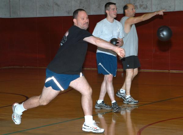 Feature Dodge ball! Three members of the 434th Air Refueling Wing take aim during the recent dodge ball tournament held at the base fitness center.