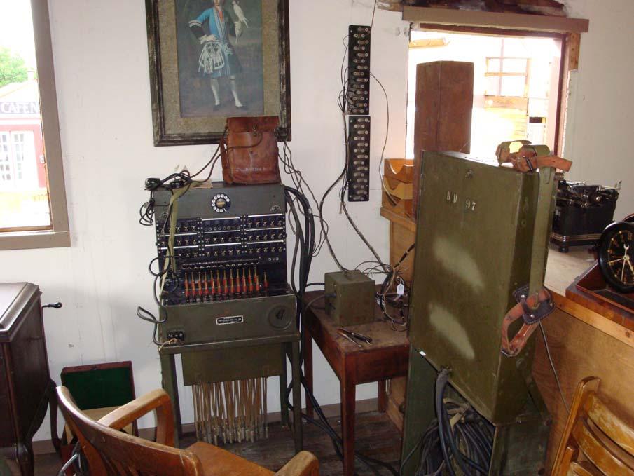 Notice the large amount of signal corps equipment to include a large switchboard and headquarters clock.