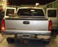 The USD was concealed inside the rear door quarter panels of a silver 2002 Chevrolet 1500 pickup bearing IN