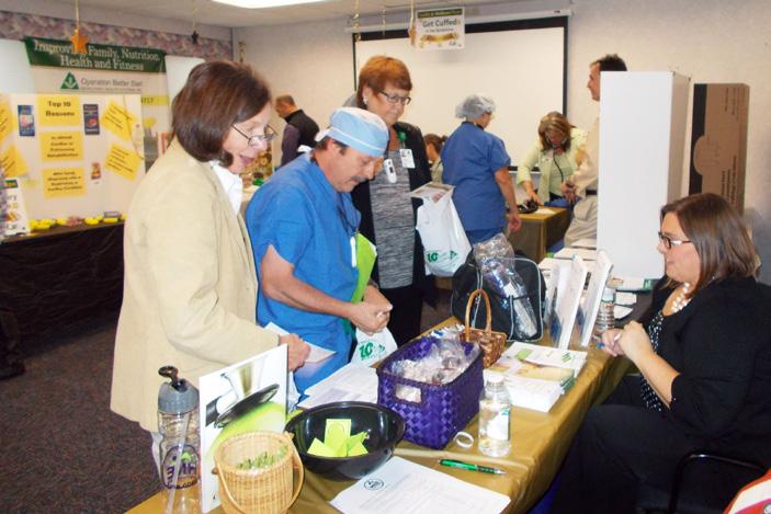 The community room at the Lenox physician practice was filled with people seeking health information and partaking in blood pressure screenings, interactive games and face-to-face discussions with