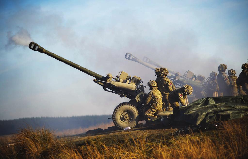 Soldiers of the Royal Artillery are pictured firing 105 mm light guns during an exercise. Commonly known as the Gunners, the Royal Artillery provides firepower to the British Army.