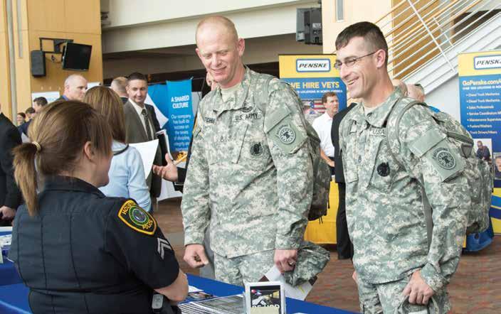 NATIONAL EMPLOYMENT PROGRAM Soon-to-transition military members explore employment opportunities at the DAV/RecruitMilitary All Veterans Career Fair at Cincinnati s Paul Brown Stadium in Oct. 2014.