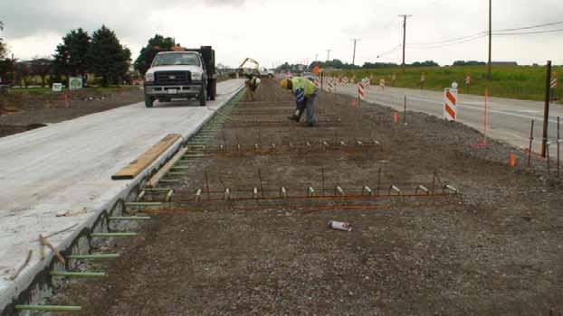 Figure 2 Dowel Basket Placement in High Speed Lane Alongside Recently Poured 9 ¾
