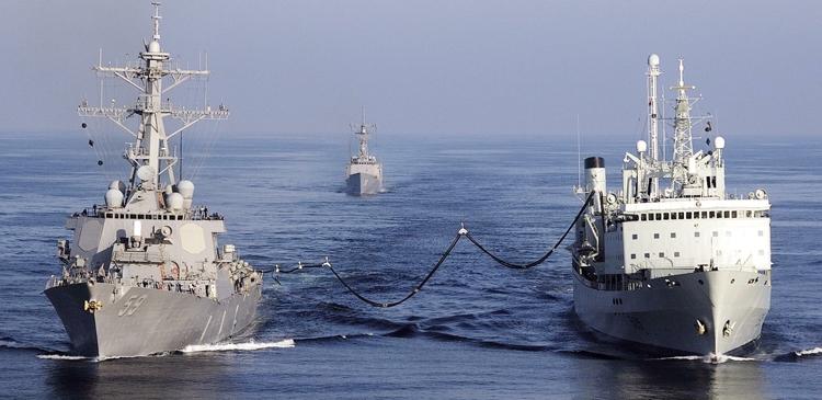 HMCS Protecteur provides fuel to the destroyer USS Russell off the coast of California during a task group exercise.