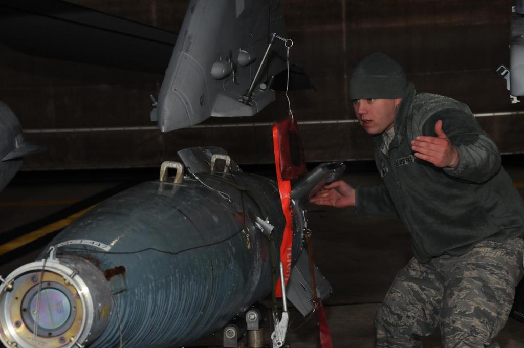 Troy Kohler from the New Jersey Air National Guard's 177th Fighter Wing prepares to mount a GBU-12 Paveway II onto an F-16C Fighting Falcon during day two of the annual load crew competition on