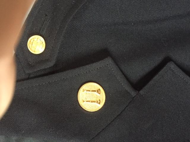 the tip of the collar as shown.