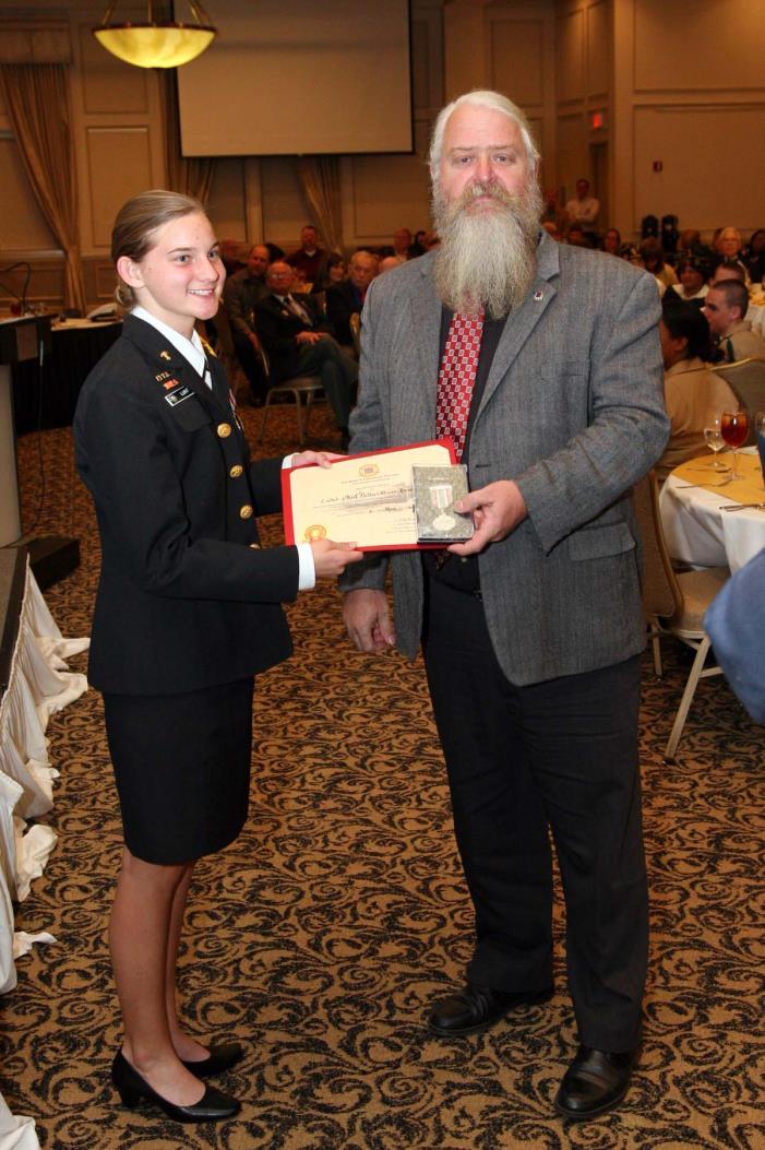 The H. L. Hunley JROTC Awards at Lincoln and Liberty County High School Photo Right: Compatriot Ellis Harvey, Chief USN Ret. Presents the H.