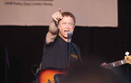 Dan Band performed covers of popular songs July 6 on the Marine Corps Air Station Futenma flight line. The concert was part of a USO Gary Sinise, left, and Dan Myers perform a song during the Lt.