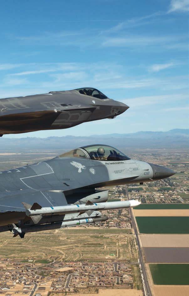 3 The first F-35A destined for Luke escorted by an F-16 as