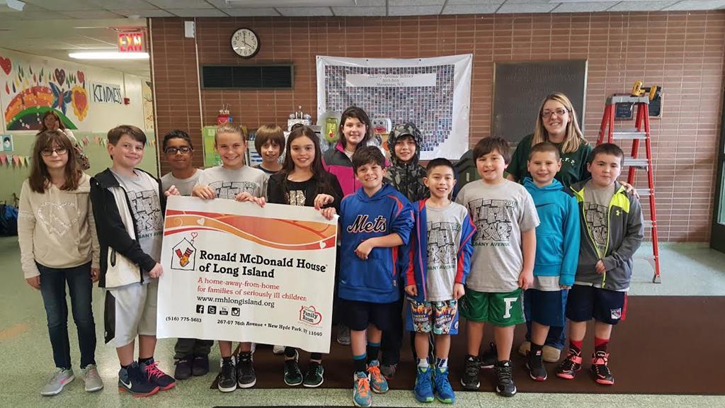 Children from the four Farmingdale Elementary Schools unified